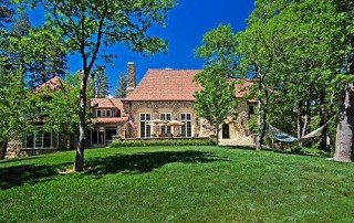 Traditional home with a pitched roof surrounded by trees in Lake Arrowhead.
